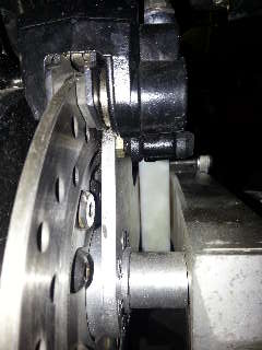 Looking from behind the end of the swing arm to show the axle spacer